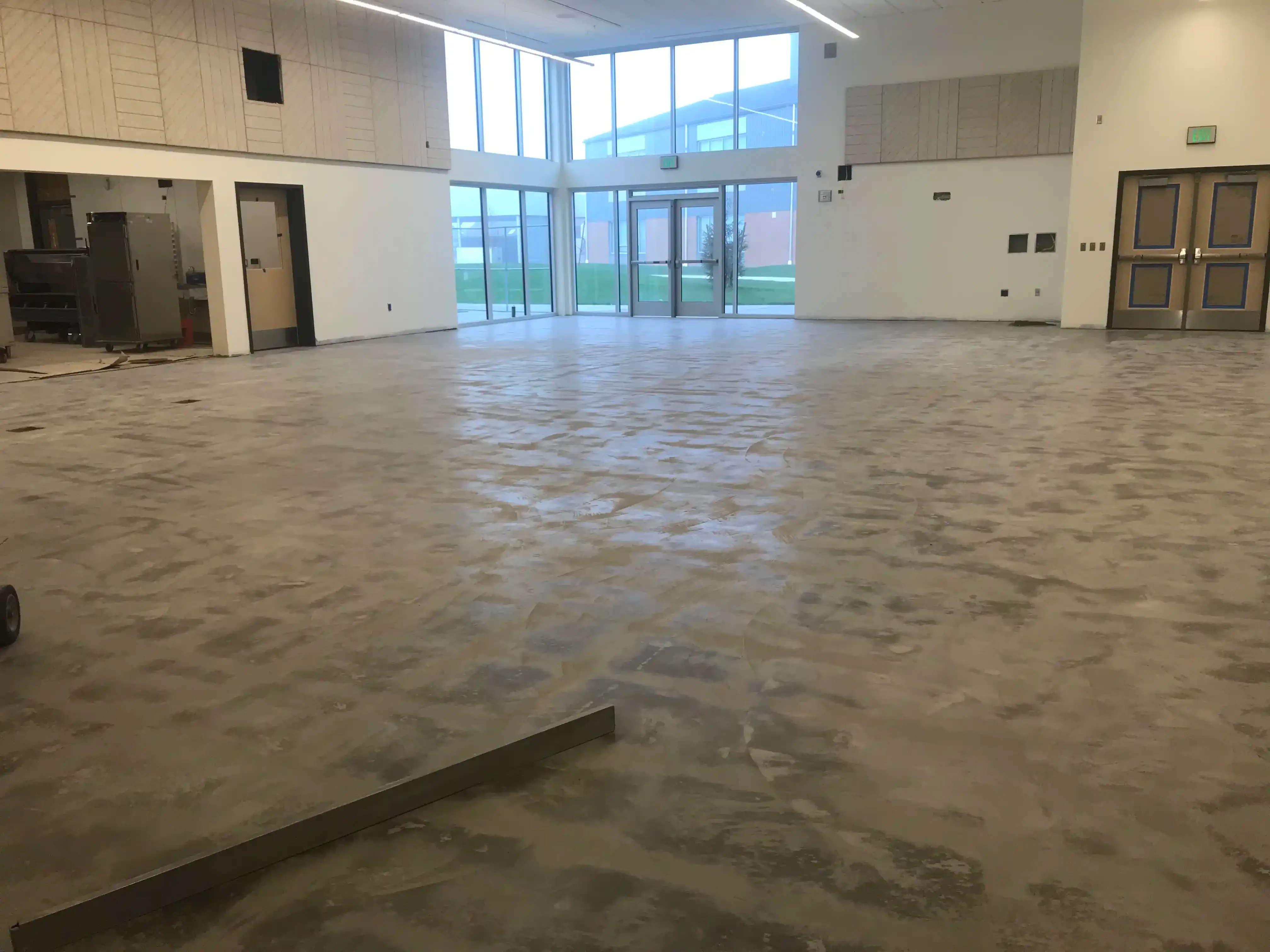 Photo of 'floor-prep' inside the commons space. Photo of 'floor-prep' inside the commons space.