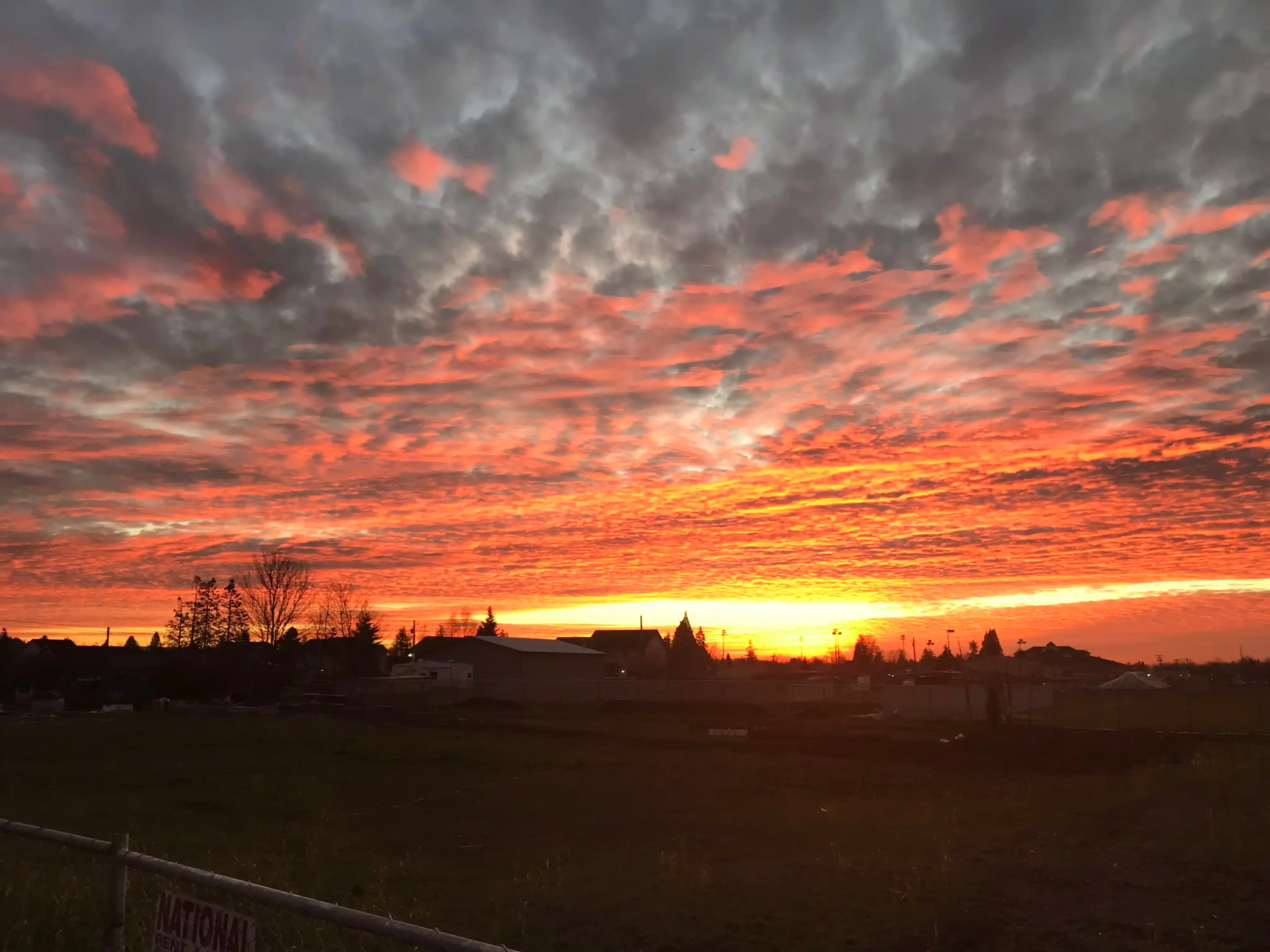 Photo of a pink-sky sunset looking west from the job-site one evening. Photo of a pink-sky sunset looking west from the job-site one evening.