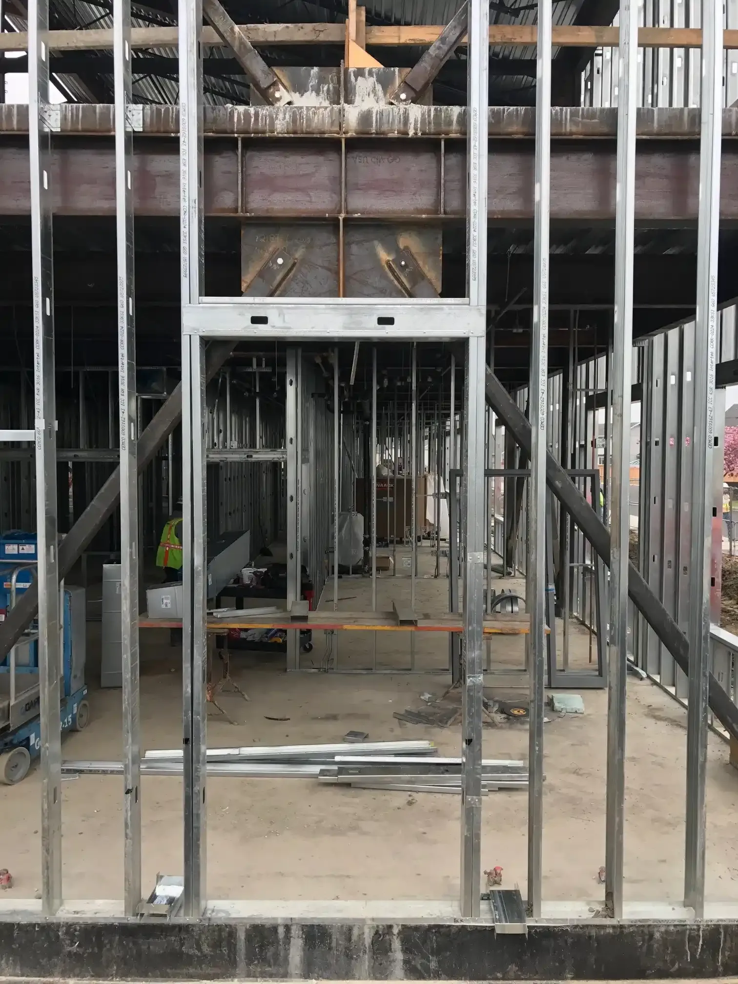 Photo of the same place at the building as the model image above but in real life, featuring the structure embedded within the metal-stud framing. Photo of the same place at the building as the model image above but in real life, featuring the structure embedded within the metal-stud framing.