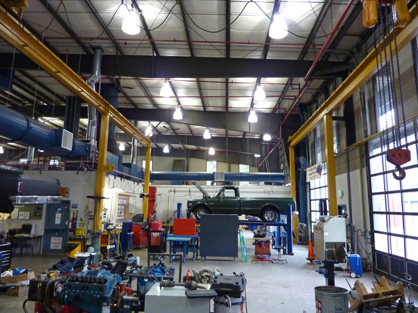 Photo, taken from inside, of the existing automotive shop inside building 22.