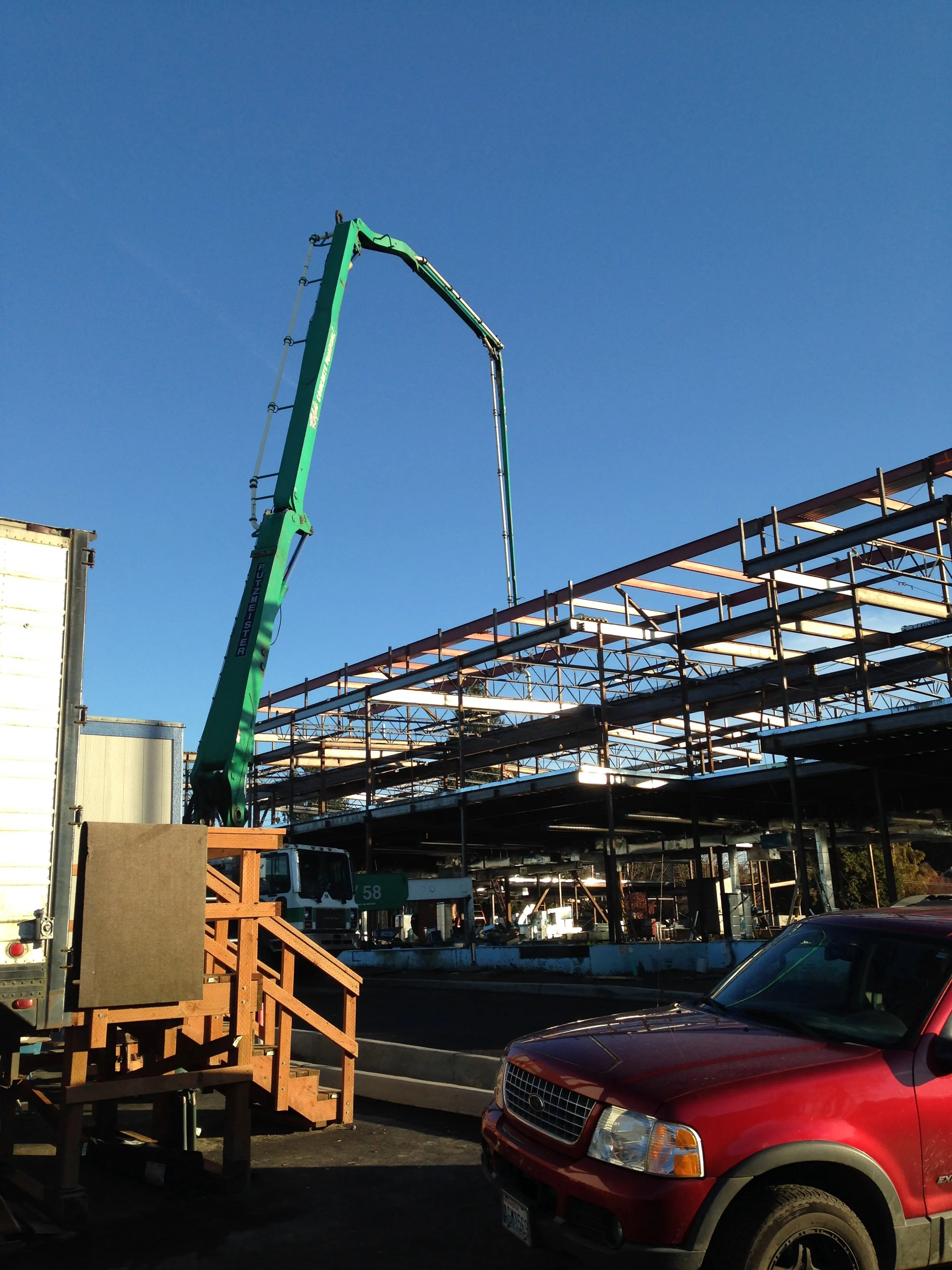 Photo of a concrete pump placing concrete on the second-level of 'B-Wing' of the new elementary school. Photo of a concrete pump placing concrete on the second-level of 'B-Wing' of the new elementary school.