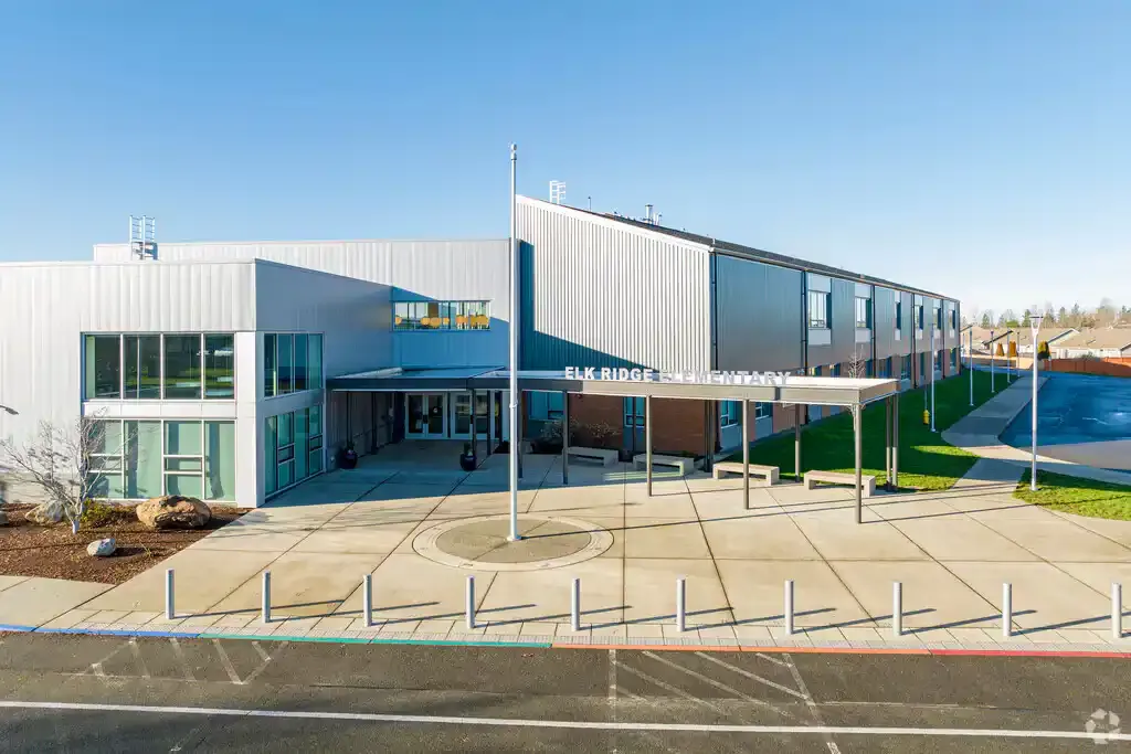 Photo of the new main entrance with raised metal sigange that reads,'Elk Ridge Elementary' above the canopy. Photo of the new main entrance with raised metal sigange that reads,'Elk Ridge Elementary' above the canopy.