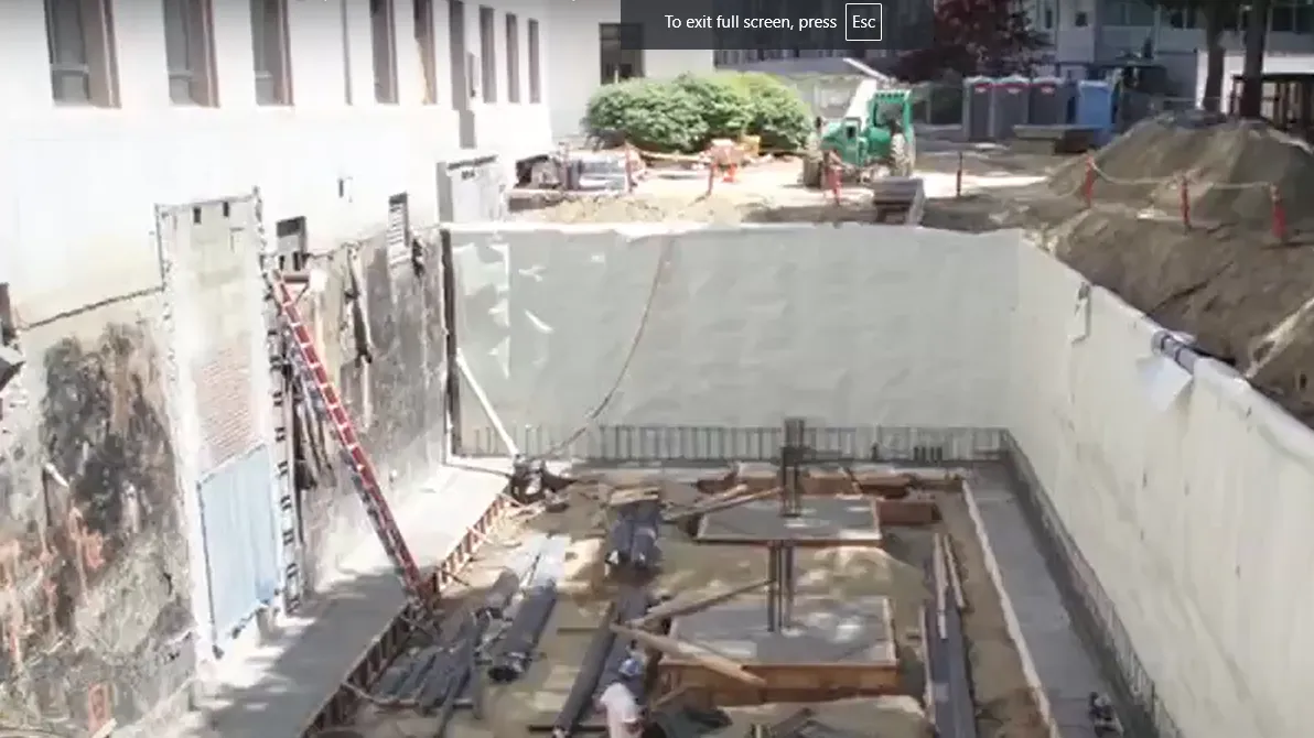 Mass excavationi behind the John L O'Brien building with waterproofing complete and some new foundations.