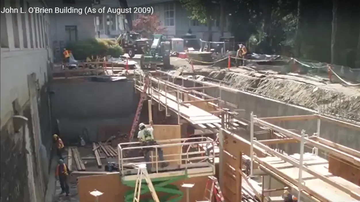 Mass excavationi behind the John L O'Brien building with temporary 'false-forms' and interior wall forms.